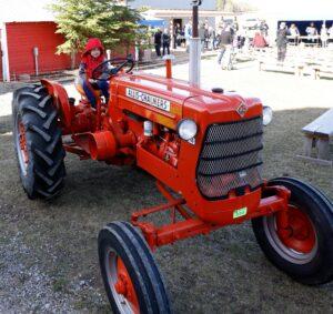 Vintage red tractor on display at community event at The Heritage Centre near Calgary, Alberta