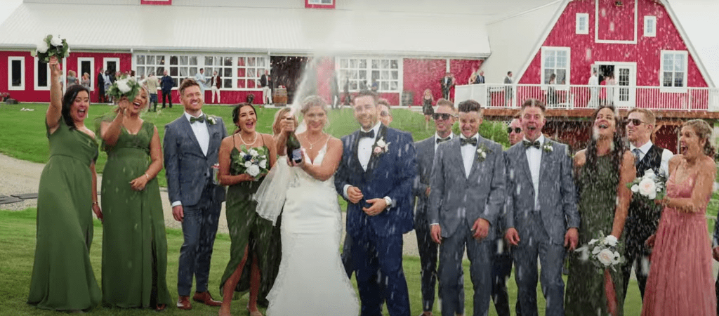 Champagne makes a wedding more fun.  The Big Red Barn Venue makes this picture perfect. 