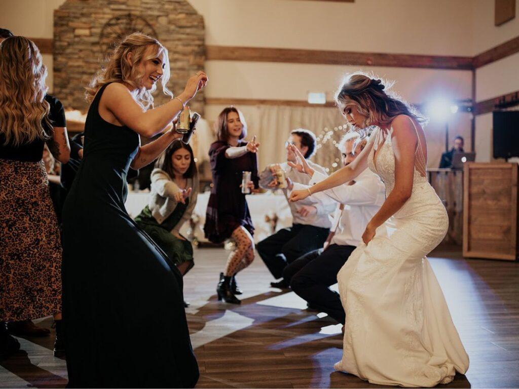 Bride and friends dance the night away in Glamorous Wedding Reception Venue located near Calgary, Ablerta 