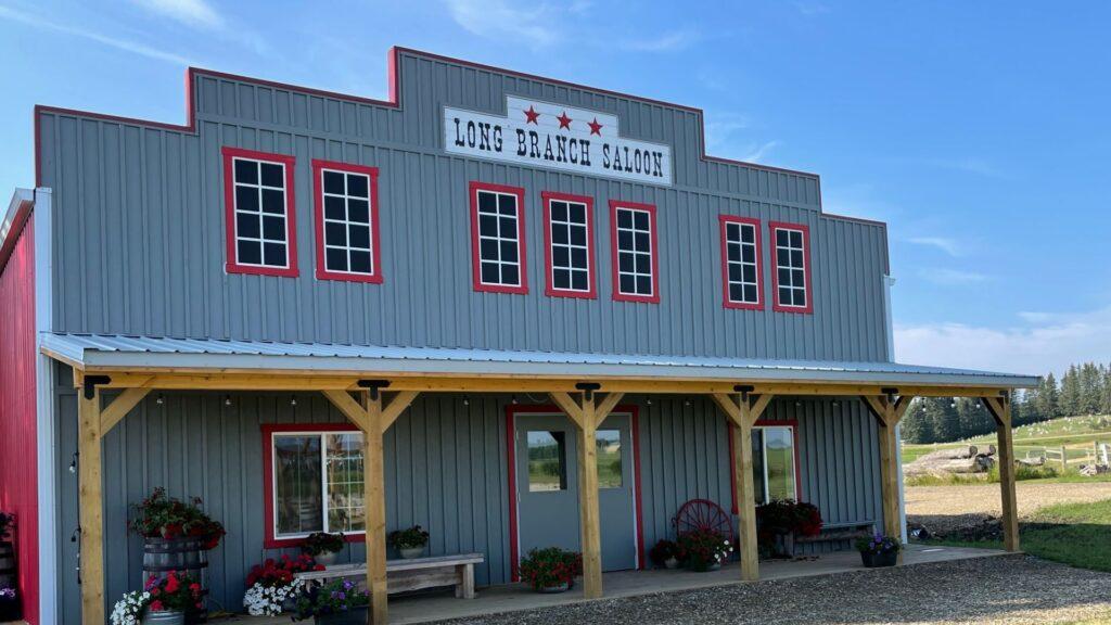 long branch 1920 1080 | The Heritage Centre by Mountain View Events Ltd. | The Heritage Centre by Mountain View Events Ltd. The exterior of the Long Branch Saloon, a western-style event venue, featuring rustic wood architecture and cowboy-inspired decor, perfect for a memorable event
