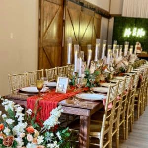 Elegant table decor at The Heritage Centre, a rustic-glam wedding and event venue near Calgary, featuring soft linens, floral centerpieces, and romantic lighting.