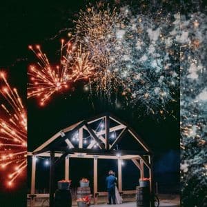 Fireworks for Website | The Heritage Centre by Mountain View Events Ltd. Bride and groom watching a dazzling fireworks display light up the night sky at The Heritage Centre, a romantic country wedding venue near Calgary.