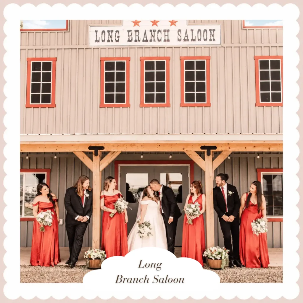 Wedding couple and their attendants standing outside the Long Branch Saloon wedding venue in Alberta.