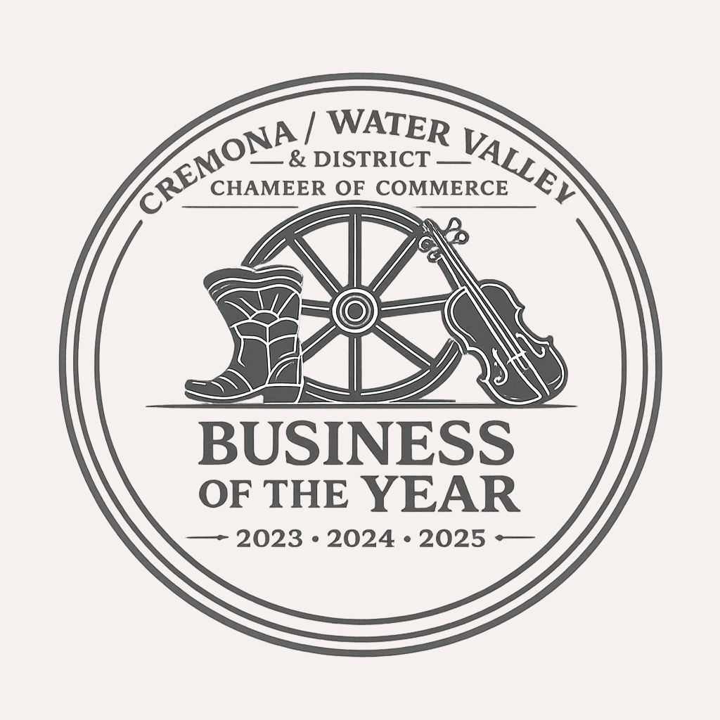 Circular award seal with a wheel, boot, and violin; text reads 'Business of the Year' (2023–2025) from Cremona/Water Valley & District Chamber of Commerce.