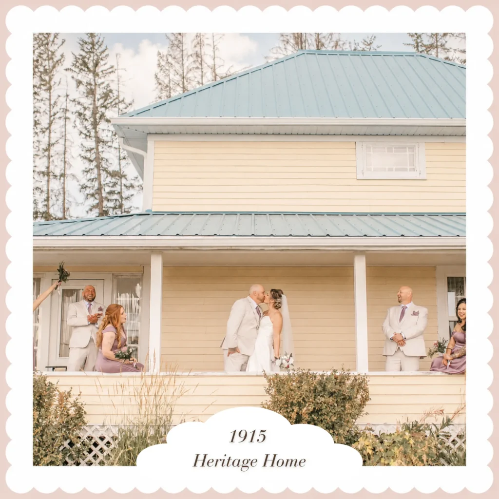 Newlywed couple kissing on the veranda of the 1915 Heritage Home with their wedding party nearby
