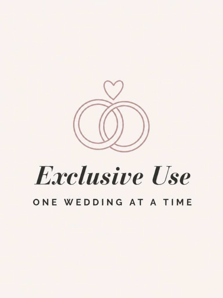 Blush interlocking wedding rings icon with text stating that the venue hosts one wedding at a time.