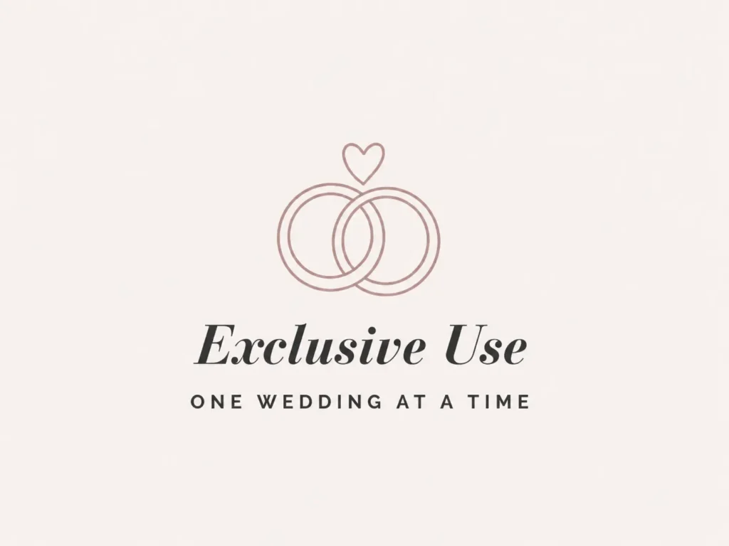 Logo showing two interlocking rings with a heart above, and the words 'Exclusive Use' and 'One Wedding At A Time'.