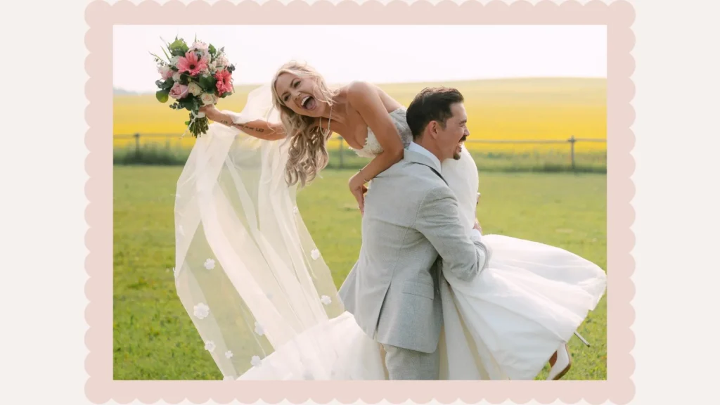 Groom carrying laughing bride on his back through a canola field near the venue