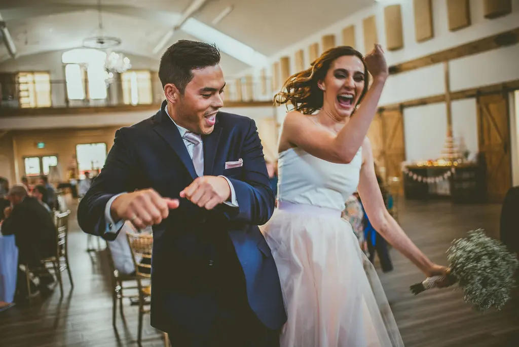Bride and groom dancing in the Grand Ballroom at The Heritage Centre in Cremona, Alberta.