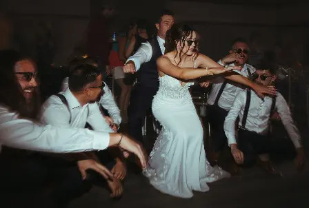 Bride dancing with her wedding party during a Grand Ballroom reception.