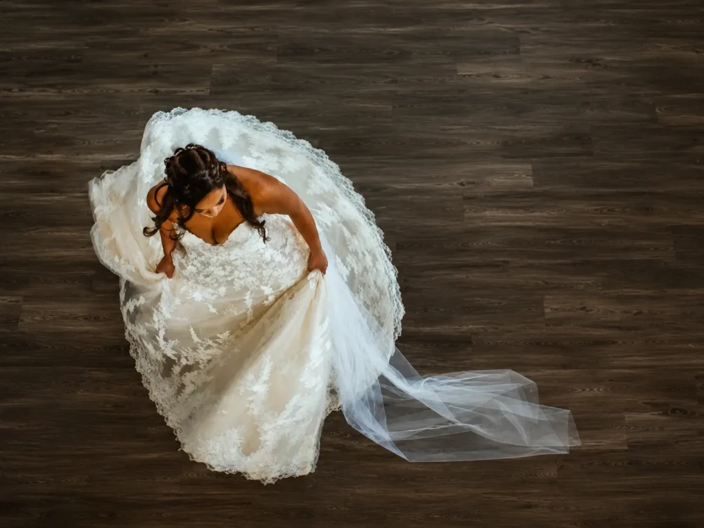 Overhead view of a bride and her lace gown on the Grand Ballroom dance floor.