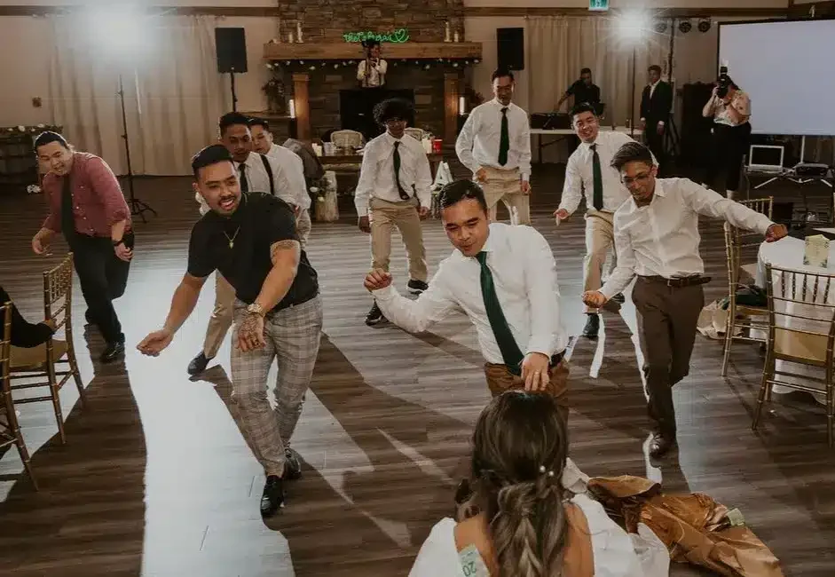 Group of wedding guests dancing in the Grand Ballroom at The Heritage Centre.